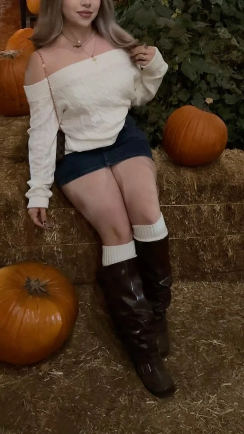 White Cable Knit Sweater + Denim Mini Skirt + Tall Brown Boots + White Leg Warmers